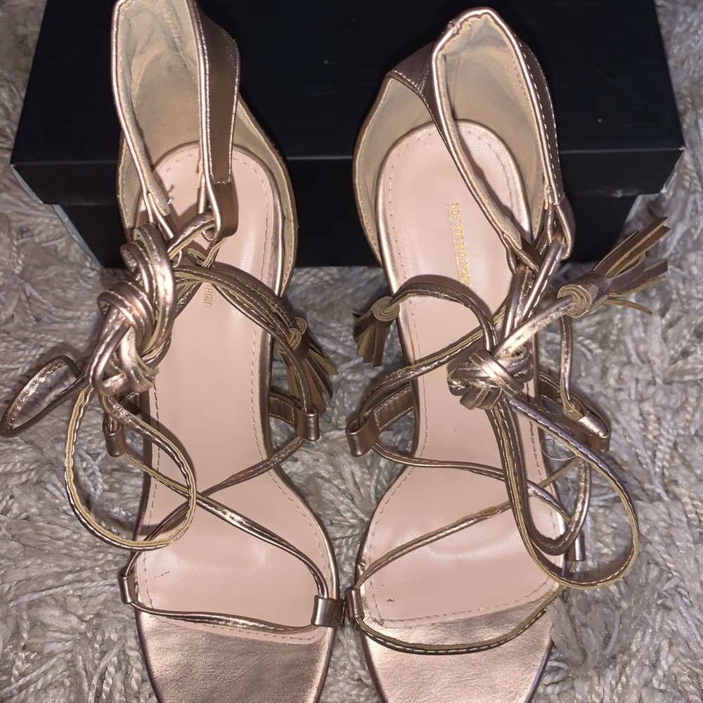 Pretty Little Thing gold tassel lace up heels